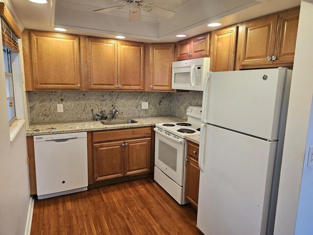 36 Islewood B, Deerfield Beach, FL 33442 - kitchen featuring white appliances, a sink, dark wood-type flooring, tasteful backsplash, and recessed lighting
