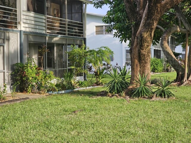 36 Islewood B, Deerfield Beach, FL 33442 - view of green lawn featuring a balcony
