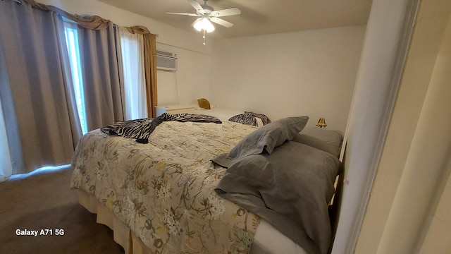 bedroom featuring ceiling fan, carpet, and a wall mounted air conditioner