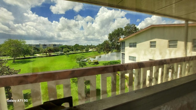 balcony featuring a water view