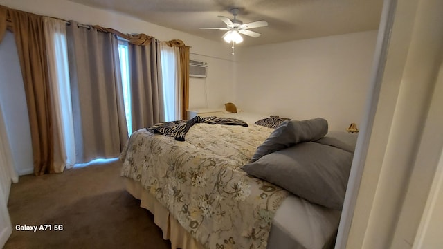 carpeted bedroom featuring ceiling fan and a wall mounted air conditioner