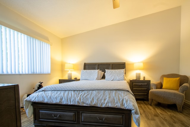 bedroom with lofted ceiling, ceiling fan, and wood-type flooring