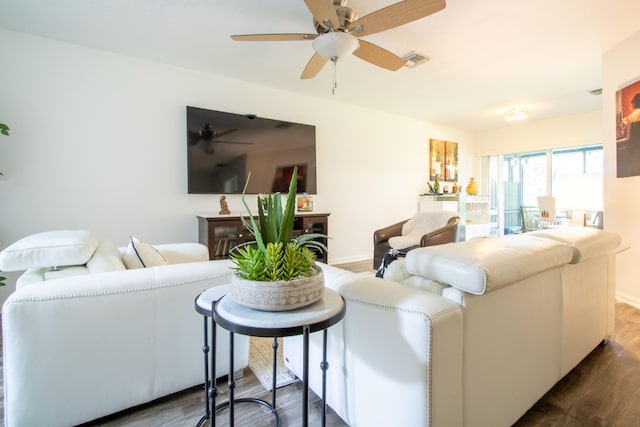 living room with hardwood / wood-style floors and ceiling fan