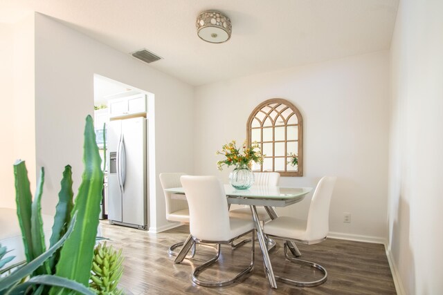 dining area featuring wood-type flooring