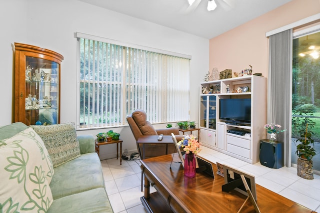 tiled living room with ceiling fan