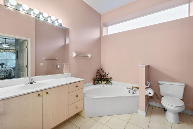 bathroom with vanity, toilet, a bath, and tile patterned floors