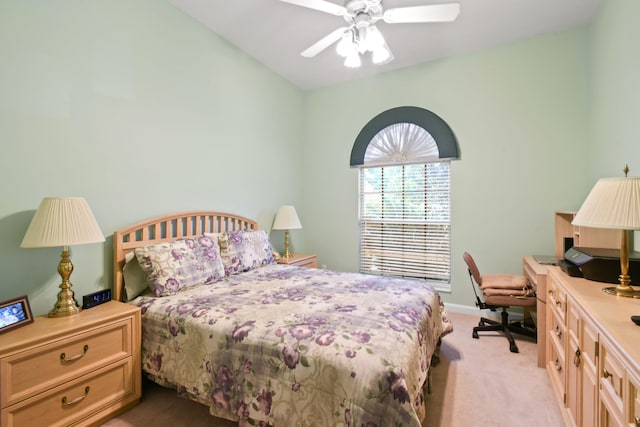 bedroom with ceiling fan and light carpet