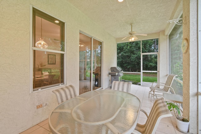 sunroom / solarium with ceiling fan