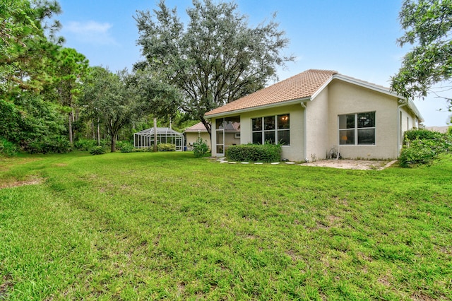 view of yard featuring a lanai