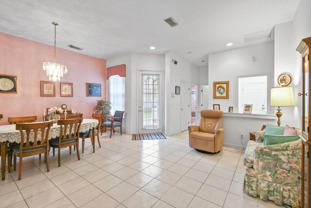 tiled living room featuring a chandelier