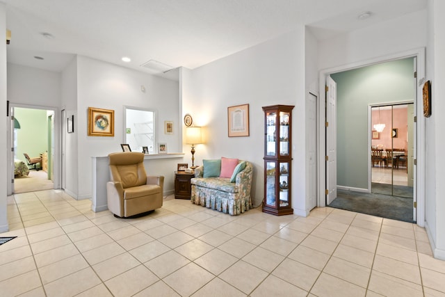 living area with light tile patterned floors