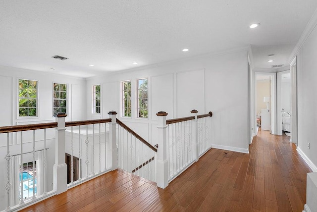 corridor featuring dark hardwood / wood-style flooring and plenty of natural light