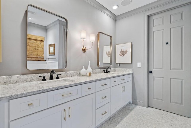 bathroom featuring crown molding and vanity