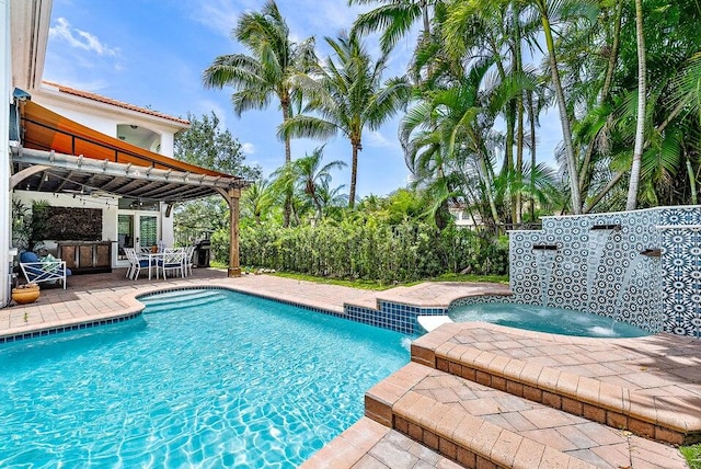 view of pool featuring an in ground hot tub, a pergola, and a patio