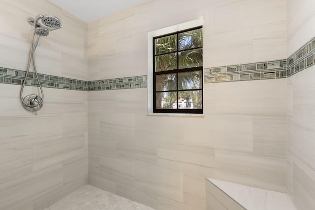 bathroom featuring a tile shower