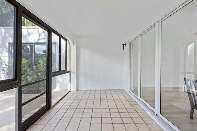 unfurnished sunroom featuring a wealth of natural light