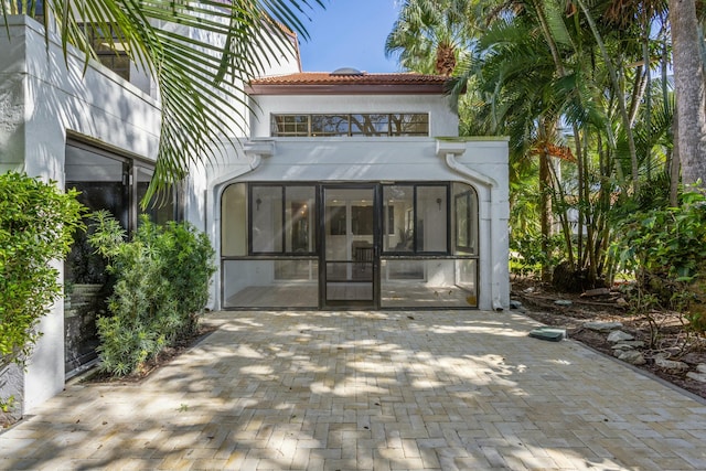 back of property featuring a sunroom