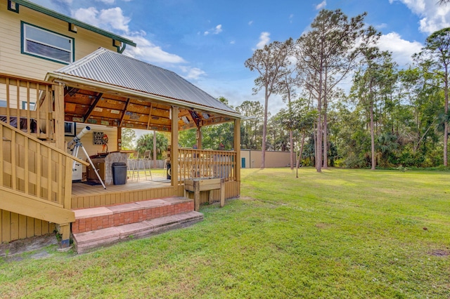 view of yard with a wooden deck