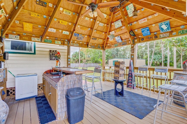 wooden deck featuring a gazebo, ceiling fan, and an outdoor wet bar