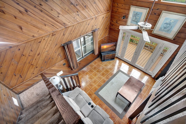 living room with wood walls and a wealth of natural light