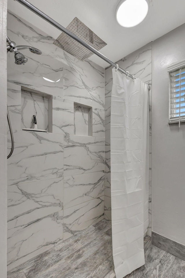 bathroom with a shower with shower curtain