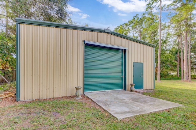 garage with a yard