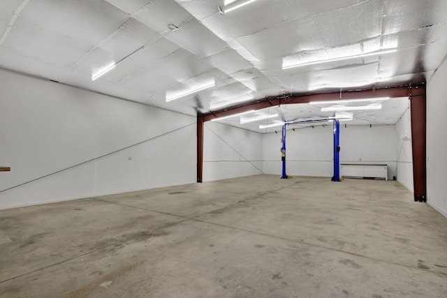 garage featuring a baseboard heating unit