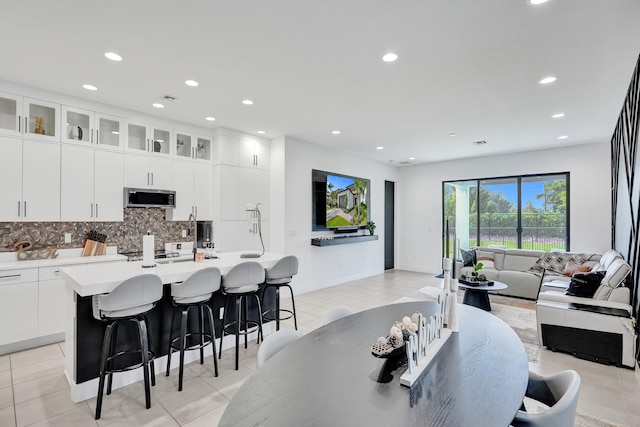 dining area featuring light tile patterned flooring