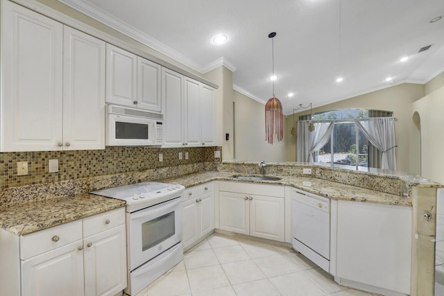 kitchen with white cabinetry, white appliances, and light stone counters