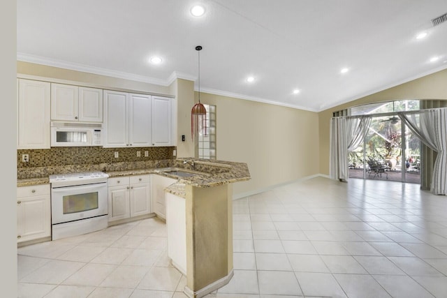 kitchen featuring light tile patterned floors, kitchen peninsula, light stone countertops, and white appliances