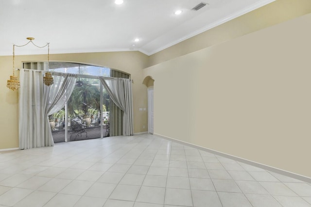 unfurnished room featuring crown molding, vaulted ceiling, and light tile patterned floors