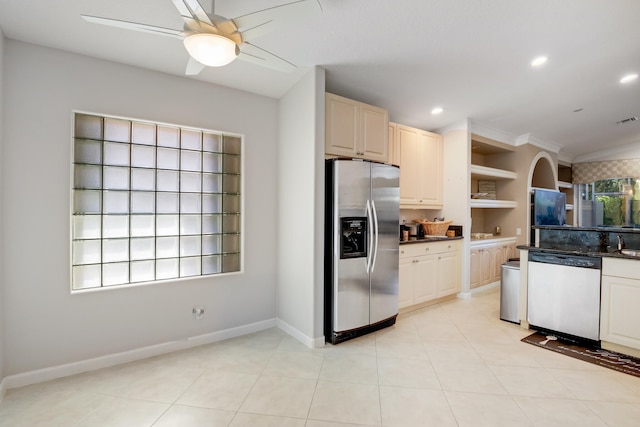 kitchen featuring ceiling fan, appliances with stainless steel finishes, crown molding, and light tile patterned floors