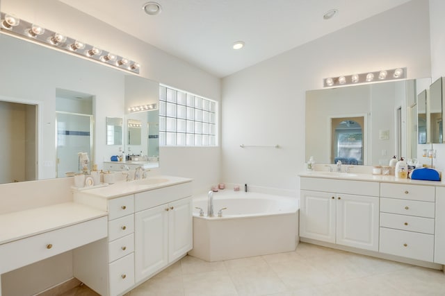 bathroom with tile patterned flooring, vanity, separate shower and tub, and vaulted ceiling