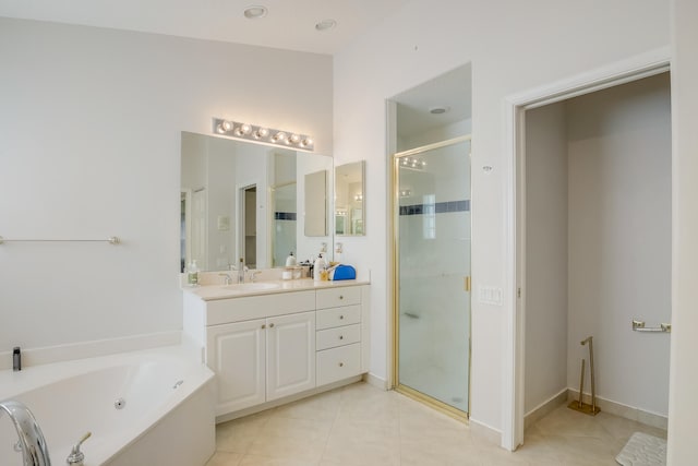 bathroom with tile patterned floors, independent shower and bath, and vanity