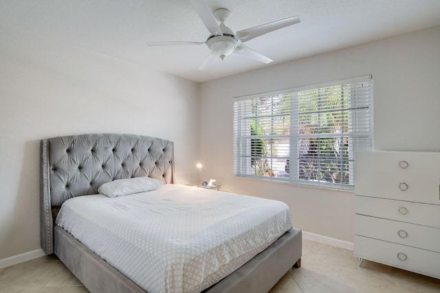 bedroom with ceiling fan and light tile patterned flooring