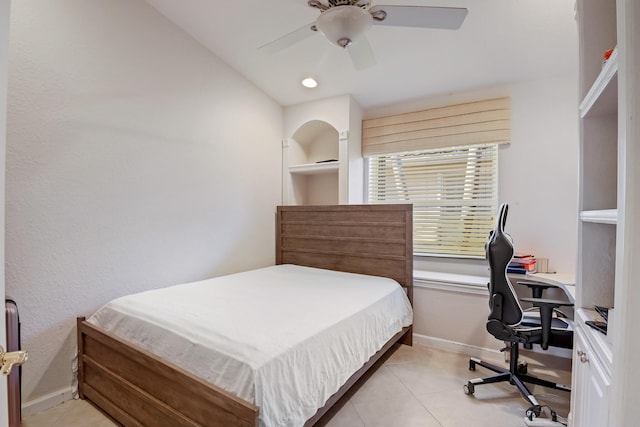 tiled bedroom featuring ceiling fan and lofted ceiling