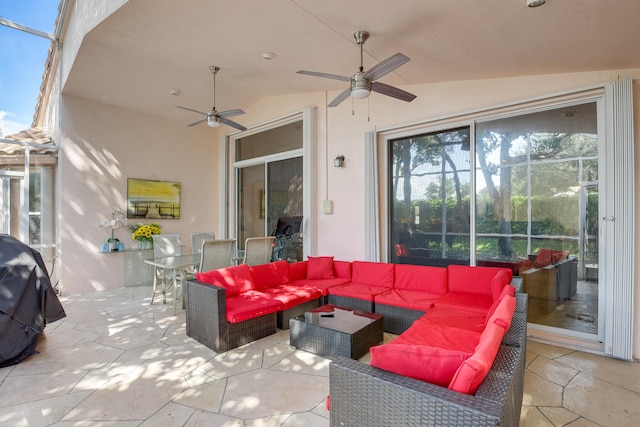 view of patio with an outdoor living space, ceiling fan, and area for grilling