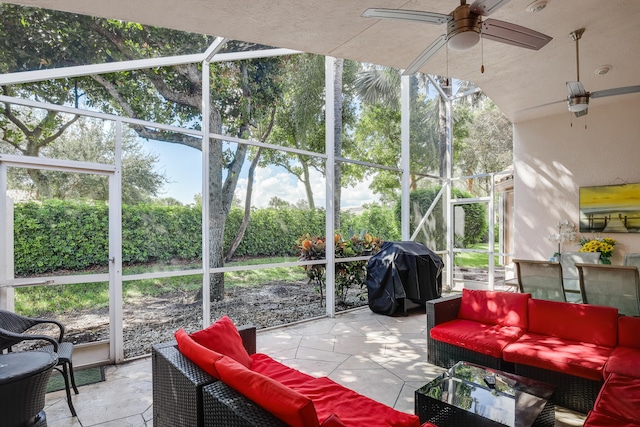 sunroom with ceiling fan and plenty of natural light