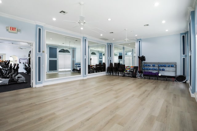 exercise room with light wood-type flooring, crown molding, and ceiling fan