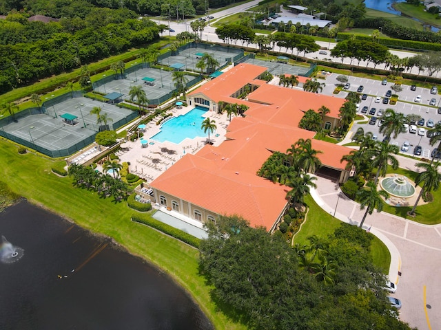 birds eye view of property with a water view