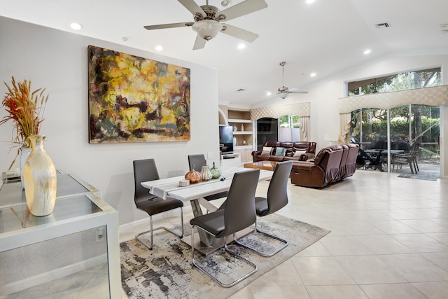 dining area featuring vaulted ceiling, ceiling fan, light tile patterned floors, and built in features