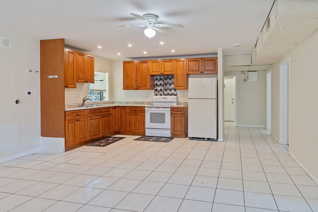 kitchen featuring white appliances, light tile patterned flooring, light stone countertops, and ceiling fan