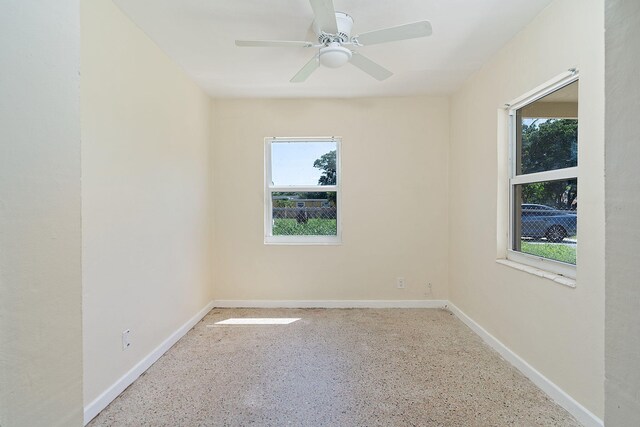 unfurnished room with ceiling fan