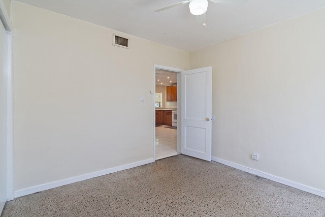 spare room with ceiling fan