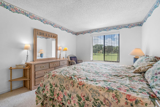 bedroom with a textured ceiling and light carpet