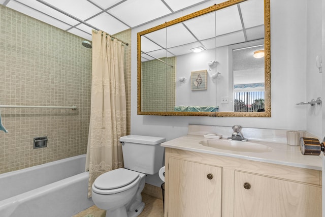 bathroom with toilet, shower / bath combo with shower curtain, and vanity