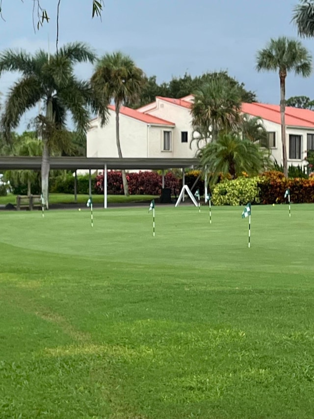 view of property's community featuring a yard