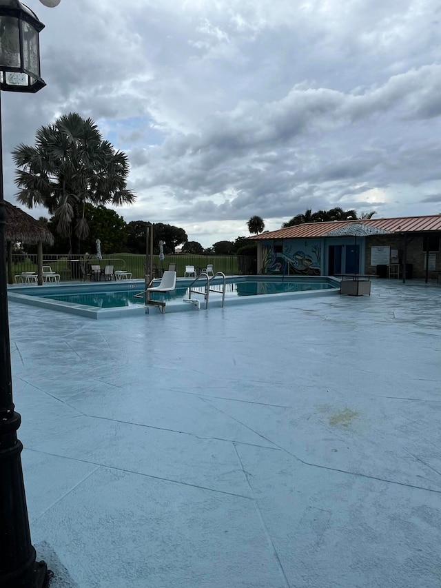 view of pool featuring a patio area