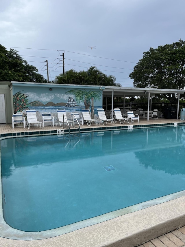 community pool featuring a patio area