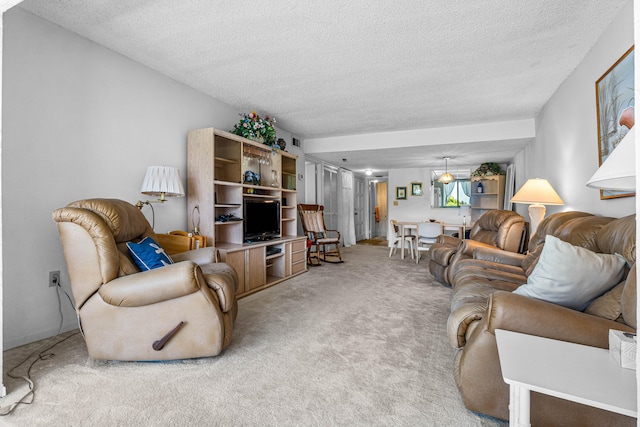 carpeted living room with a textured ceiling